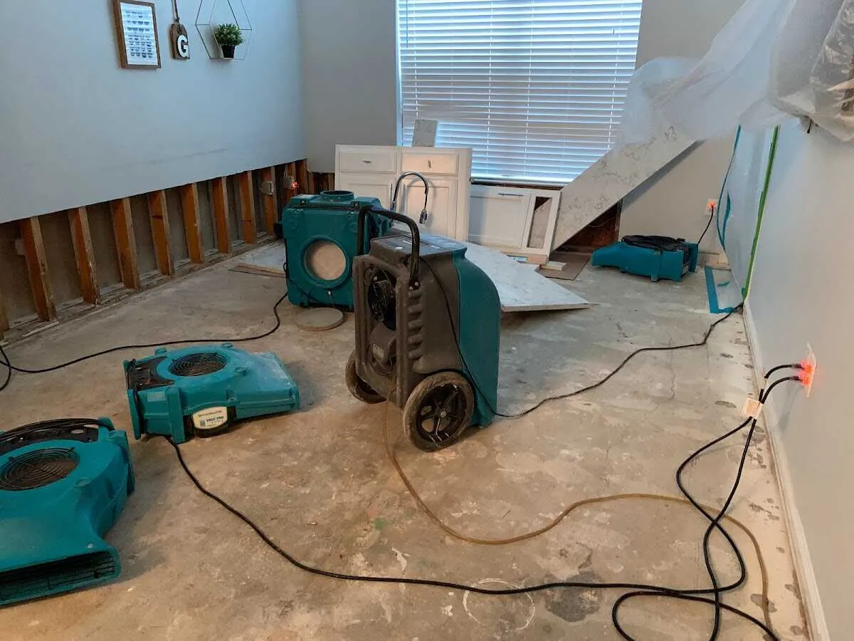 Dehumidifier in flood-cut room for Water Damage Restoration in Derby